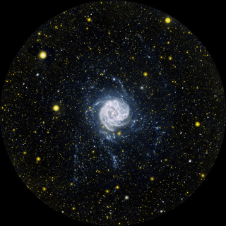 Illustration for article titled A Galaxy Unwinds, 140,000 Light Years From Its Core